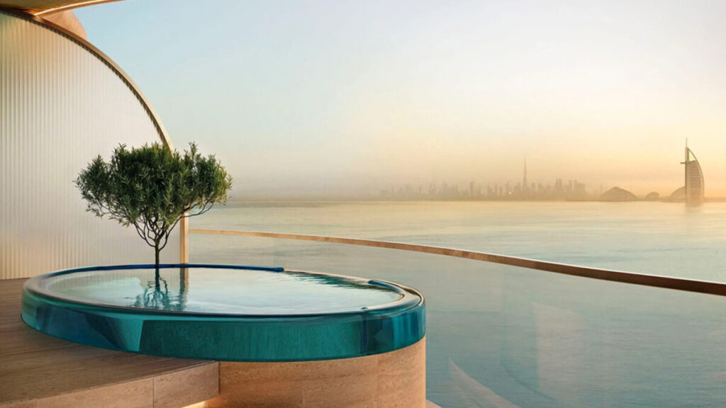 Maison Margiela Residences Balcony with the view of Burj Al Arab across the sea and in the distance Burj Khalifa