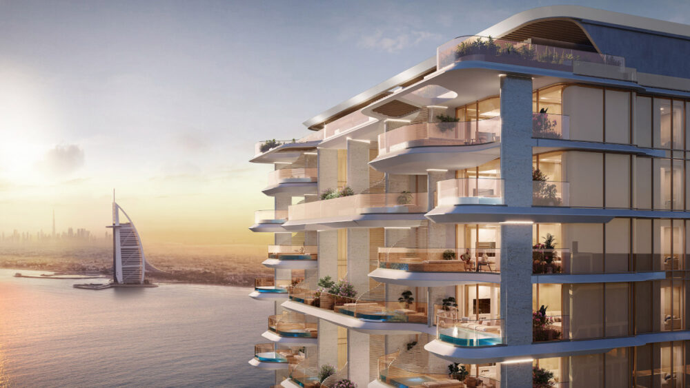 top floors and view of Burj Al Arab, Burj Khalifa appears in the distance